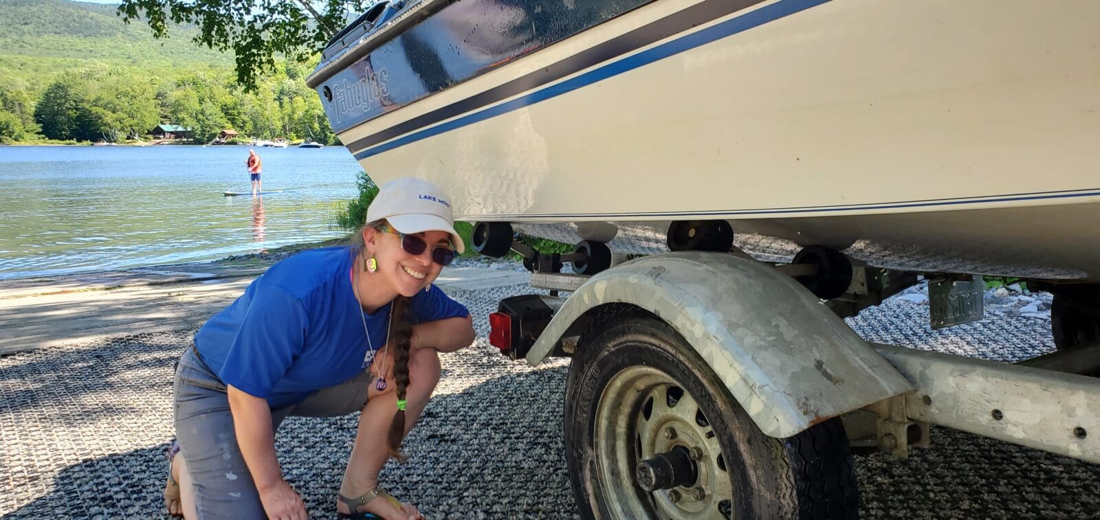 Lake Host inspecting the underside of a boat before entry to a NH Lake